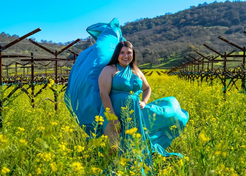 Young woman in mustard field during a Flying Dress Experience Photoshoot in Napa Valley