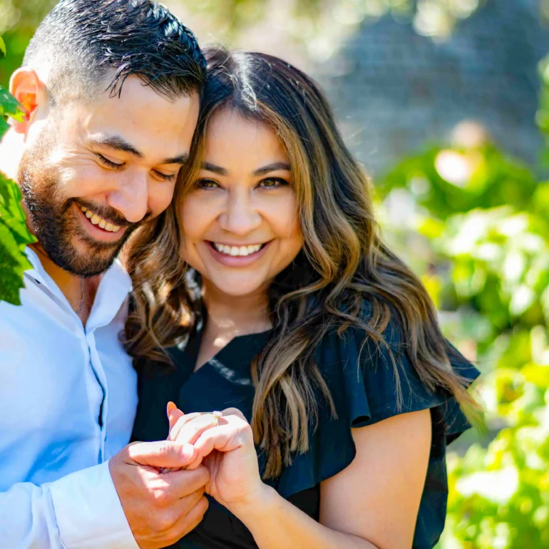 Sonoma proposal photographer taking photo of newly engaged couple in vineyard