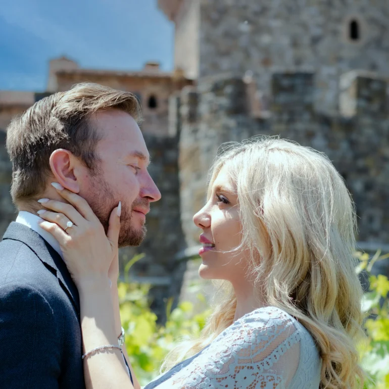 Castello di Amorosa proposal photographer capturing newly engaged couple in vineyard