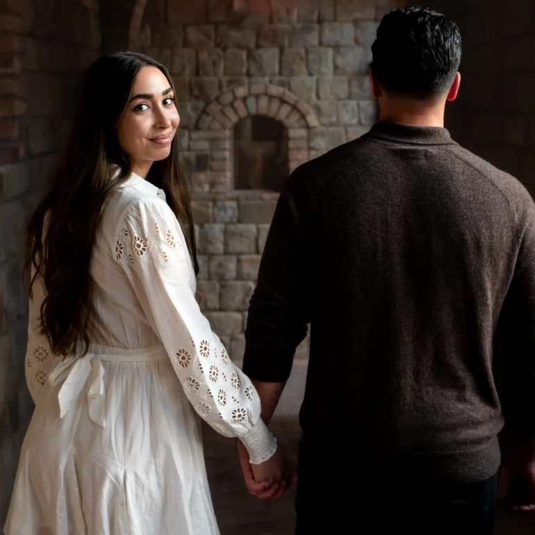 Couple walking away from Napa proposal photographer at Castello di Amorosa